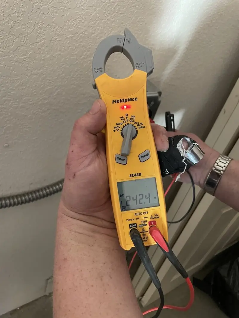 Voltage testing with clamp meter during Whole House Surge Protector in Marksville